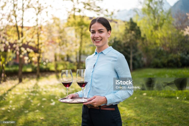 Lady waiter serving food.